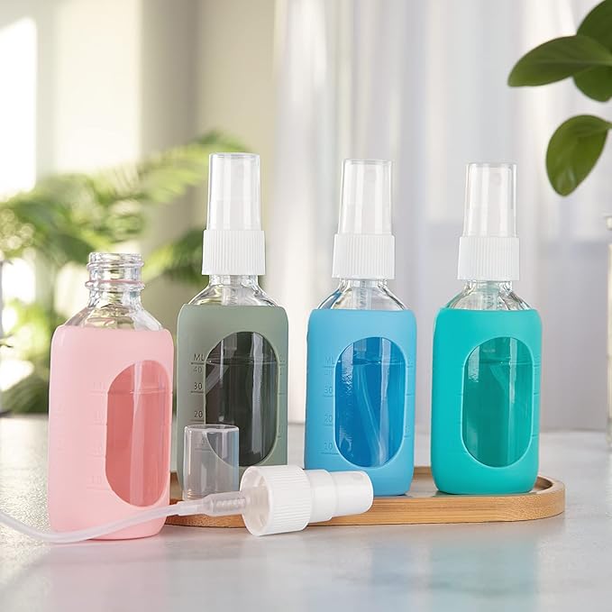 HOMBYS Empty Clear Glass 2oz Small Spray Bottles with Silicone Sleeve Protection - Refillable Containers for Travel, Cleaning Solutions, Essential Oils, Sanitizers - Fine Mist Spray - 4 Pack-Clear